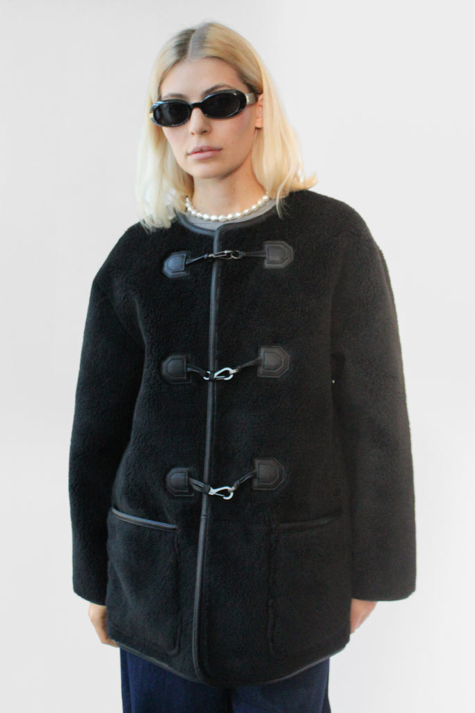 Dunst Collarless Buckled Shearling Jacket in Black at Parc Shop | Minneapolis, MN