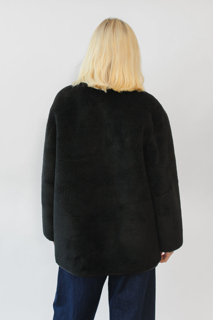 Dunst Collarless Buckled Shearling Jacket in Black at Parc Shop | Minneapolis, MN
