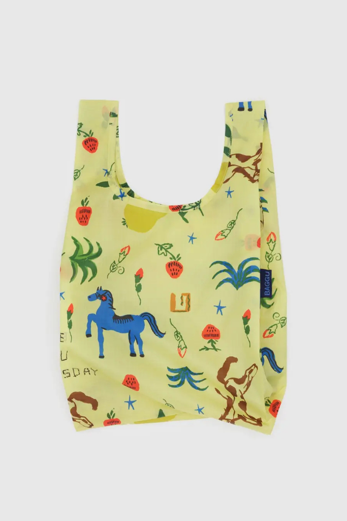 Reusable shopping bag with colorful animal and nature pattern on a light yellow background