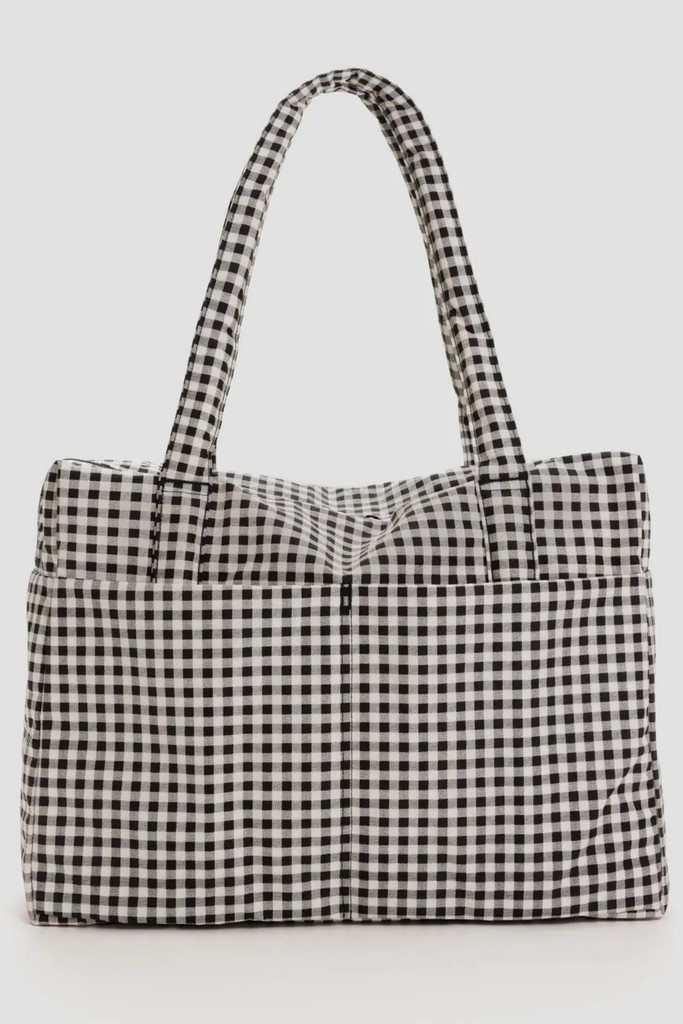 Black and white checkered tote bag on a light gray background