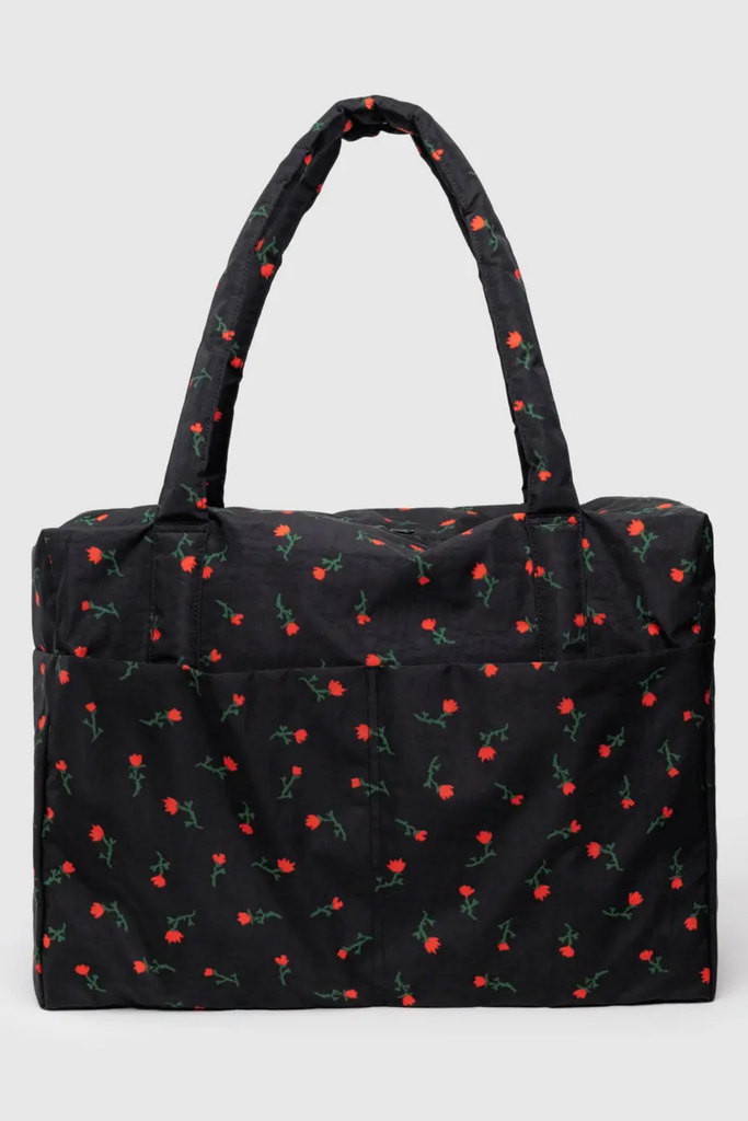Black tote bag with red floral pattern on a light gray background