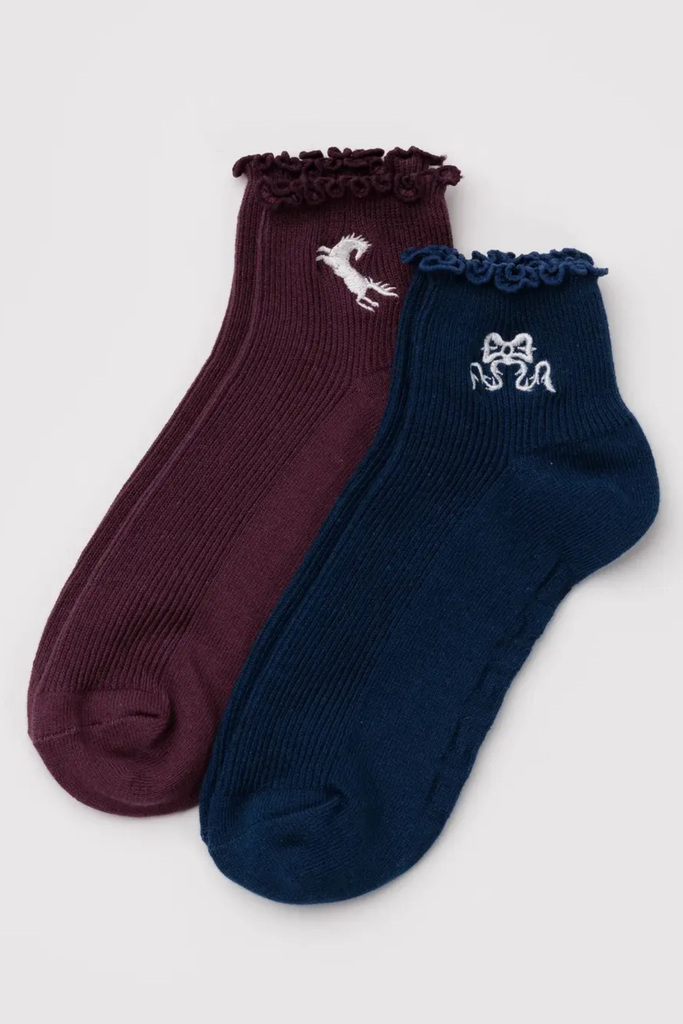 Two pairs of socks, one maroon and one navy, with small embroidered designs on a light gray background.