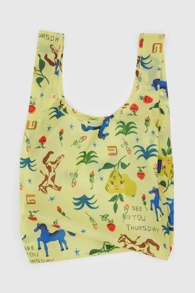 Reusable bag with colorful animal and plant designs on a light yellow background